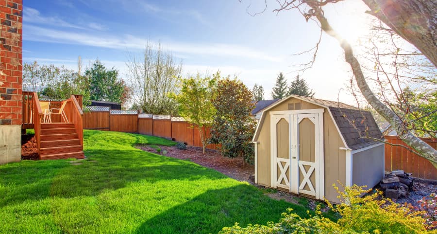 Fenced backyard with storage shed in Naperville